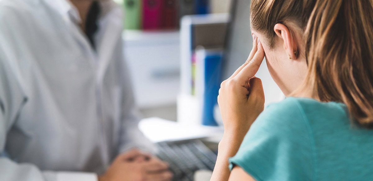 woman suffering from headaches