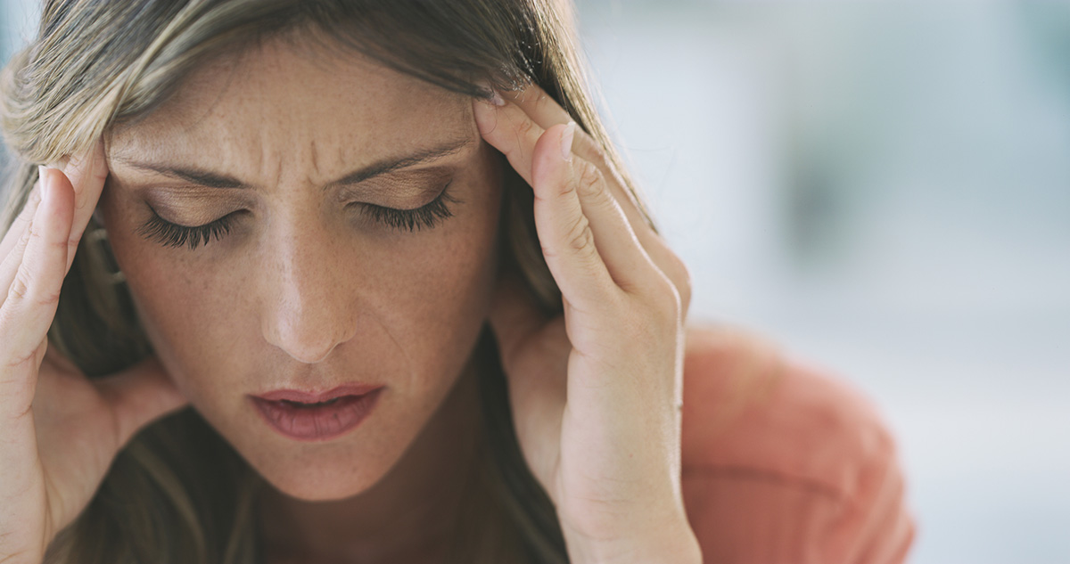 woman who suffers from headaches gets treatments