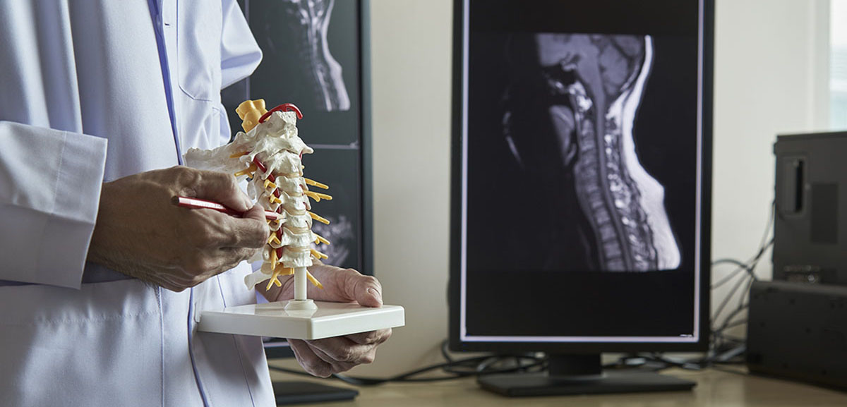 neurosurgeon pointing out how he will perform Anterior Cervical Discectomy & Fusion