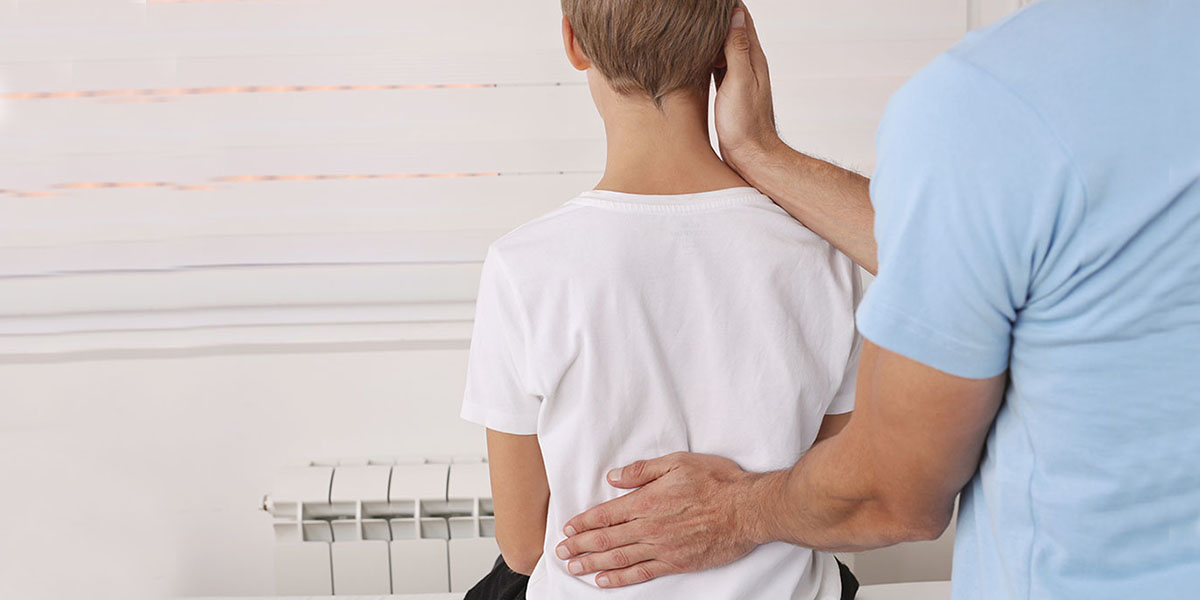 doctor examining a child with chiari malformations