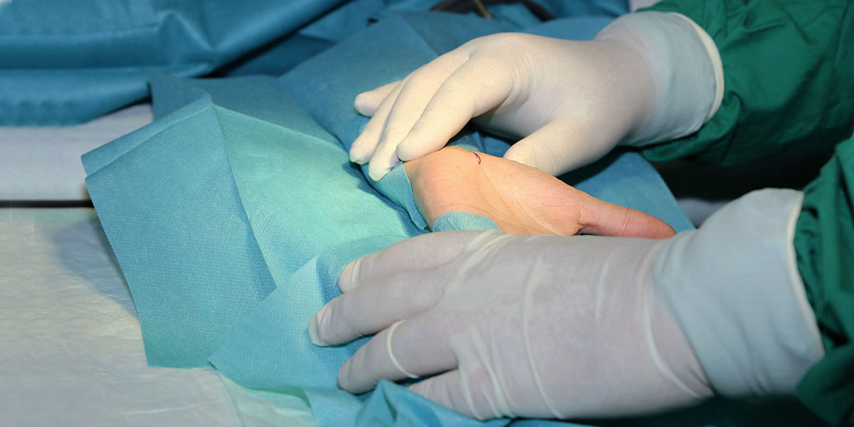 surgeon performing Endoscopic Carpal Tunnel Release