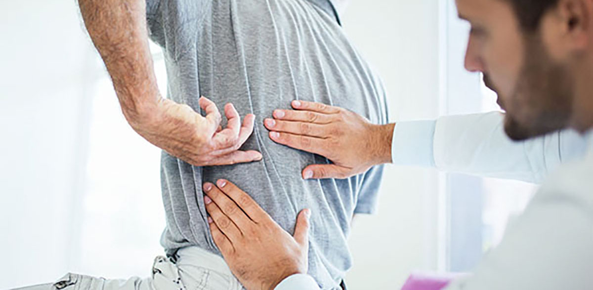 doctor examining a patient with Failed Back Syndrome