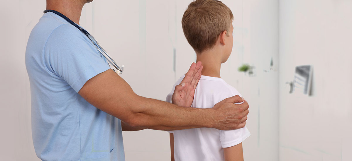 scoliosis physicians examining a patient