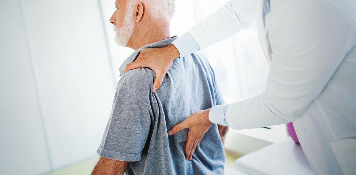 doctor examine a patient with Spondylolisthesis